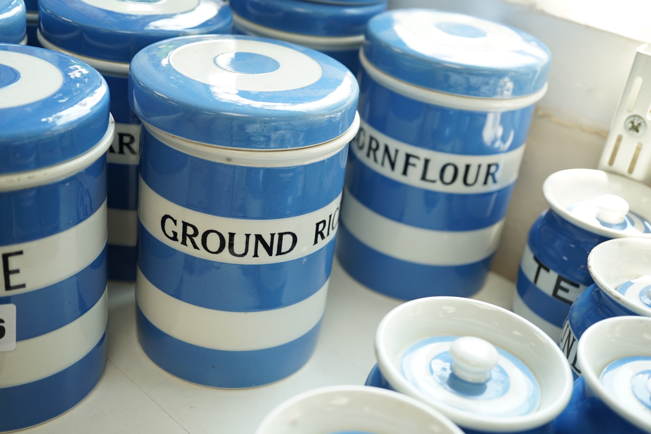 T.G.Green Cornish Kitchenware, ten 14cm lidded storage jars to include Green-Peas, Split- Peas, Cornflour, Ground Rice and Barley, mainly Black Shield marks. Condition - poor, fair and good